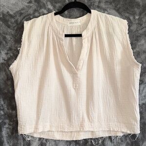 Chic Cream Sleeveless Blouse by [Brand]